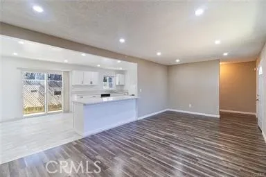 a view of kitchen with wooden floor