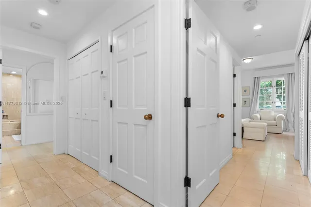 a spacious bathroom with a glass shower door and a shower