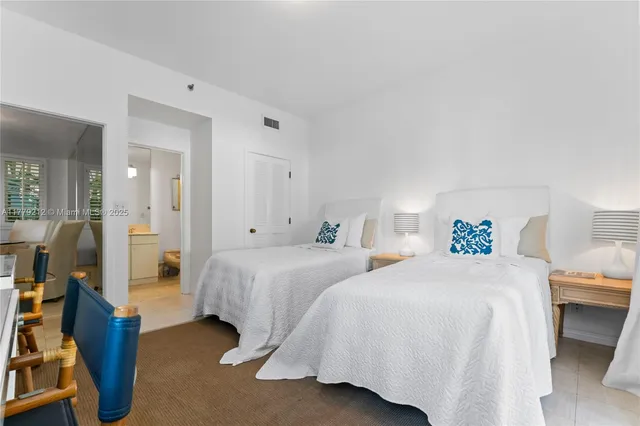 a bathroom with a toilet a sink and shower