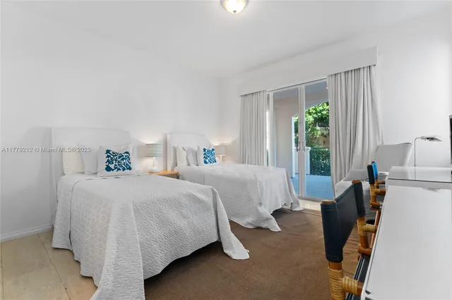 a kitchen with cabinets and chairs