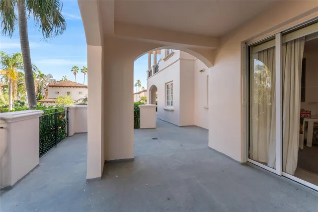a view of a hallway with bathroom and front door