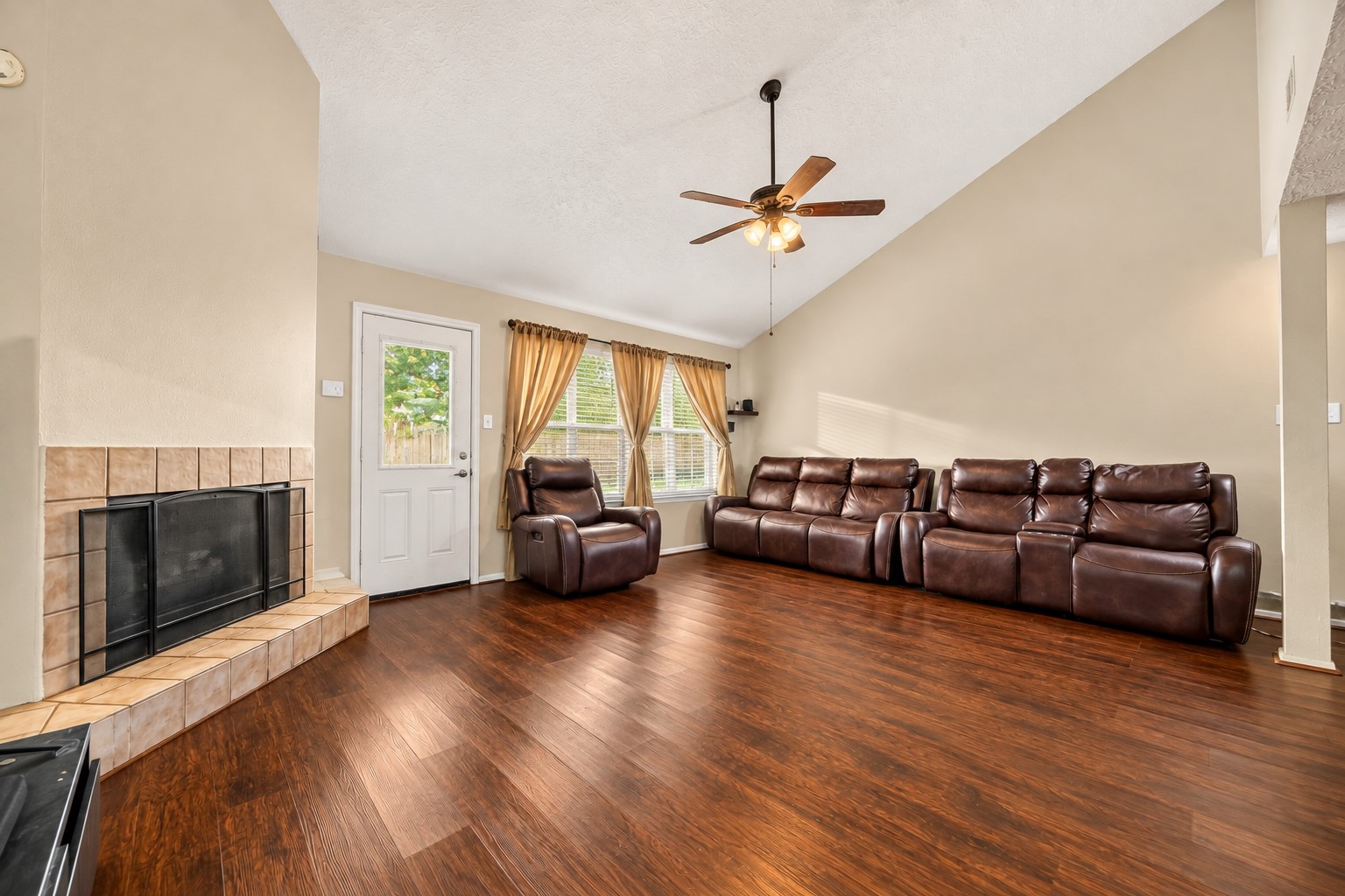 2307 Spring Dusk Drive Spring, TX 77373 - Photo 2 of 17 Living room with vaulted ceiling and wood floors