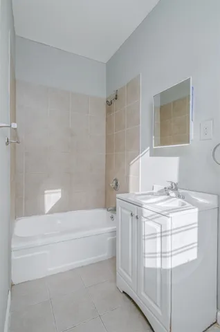 a bathroom with a sink a toilet and bathtub