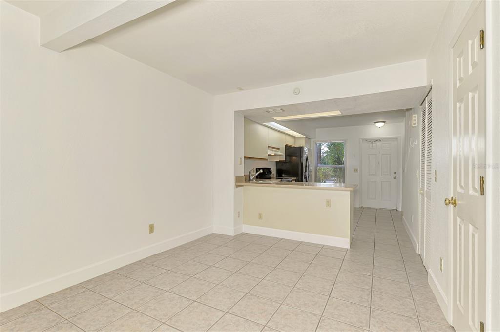26310 Rampart Boulevard, Unit 505/E Punta Gorda, FL 33983 - Photo 18 of 64 a view of a hallway to a kitchen
