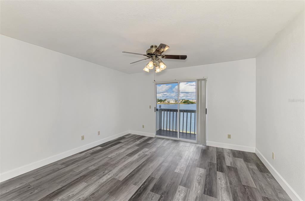 26310 Rampart Boulevard, Unit 505/E Punta Gorda, FL 33983 - Photo 23 of 64 wooden floor in an empty room with a window