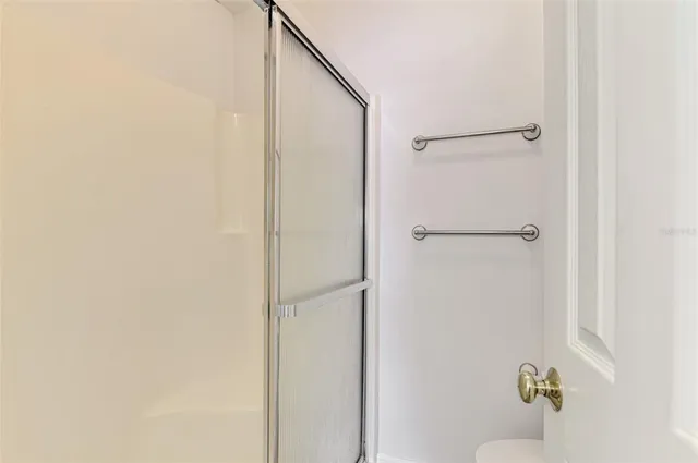 a bathroom with a sink and a washer dryer