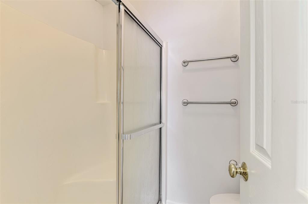 26310 Rampart Boulevard, Unit 505/E Punta Gorda, FL 33983 - Photo 27 of 64 a bathroom with a shower