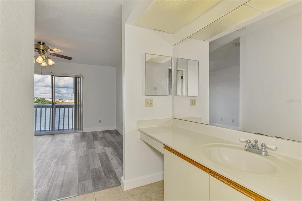 26310 Rampart Boulevard, Unit 505/E Punta Gorda, FL 33983 - Photo 28 of 64 a bathroom with a sink and a mirror