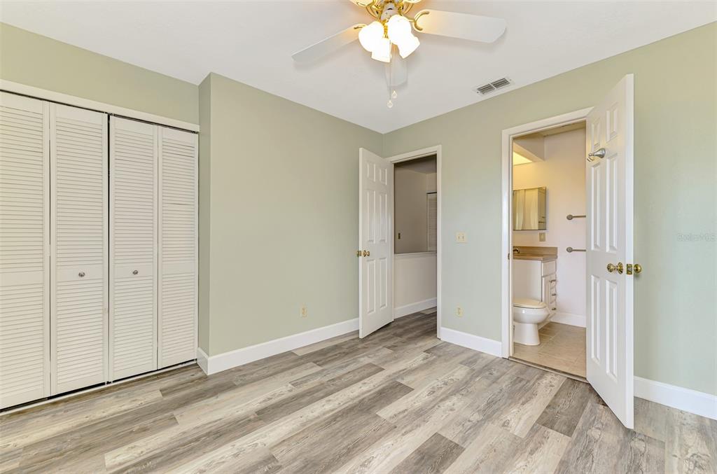 26310 Rampart Boulevard, Unit 505/E Punta Gorda, FL 33983 - Photo 33 of 64 a view of a room with wooden floor and a bathroom