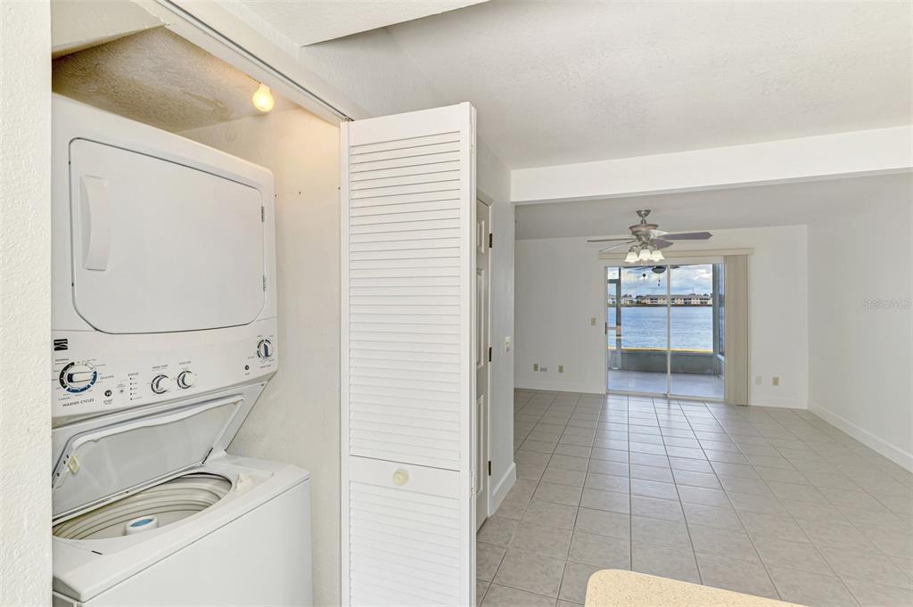 26310 Rampart Boulevard, Unit 505/E Punta Gorda, FL 33983 - Photo 35 of 64 a view of washer and dryer with bathroom in the background