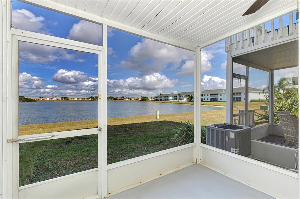26310 Rampart Boulevard, Unit 505/E Punta Gorda, FL 33983 - Photo 40 of 64 a view of a glass door with a yard from a living room