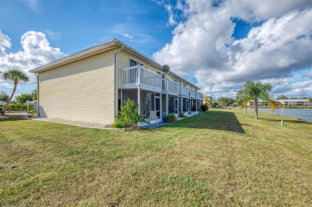 26310 Rampart Boulevard, Unit 505/E Punta Gorda, FL 33983 - Photo 41 of 64 a view of a house with backyard and garden
