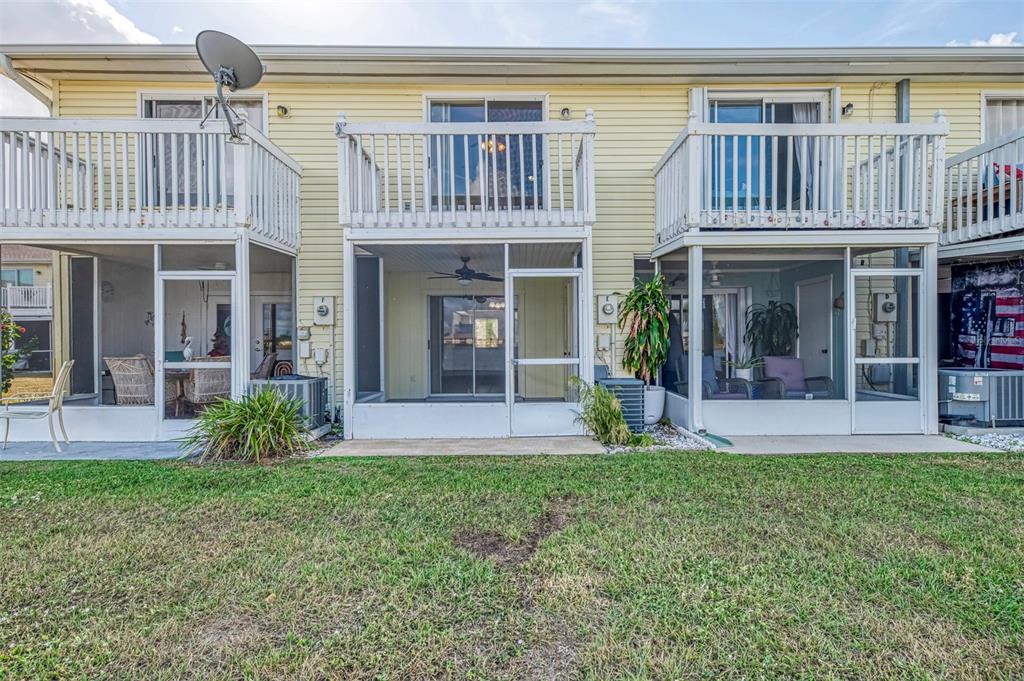 26310 Rampart Boulevard, Unit 505/E Punta Gorda, FL 33983 - Photo 42 of 64 a view of a building with a garden