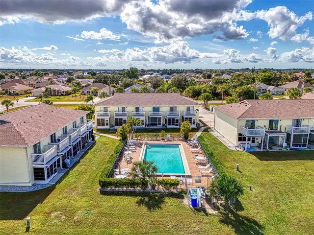 a view of a patio with a table and chairs