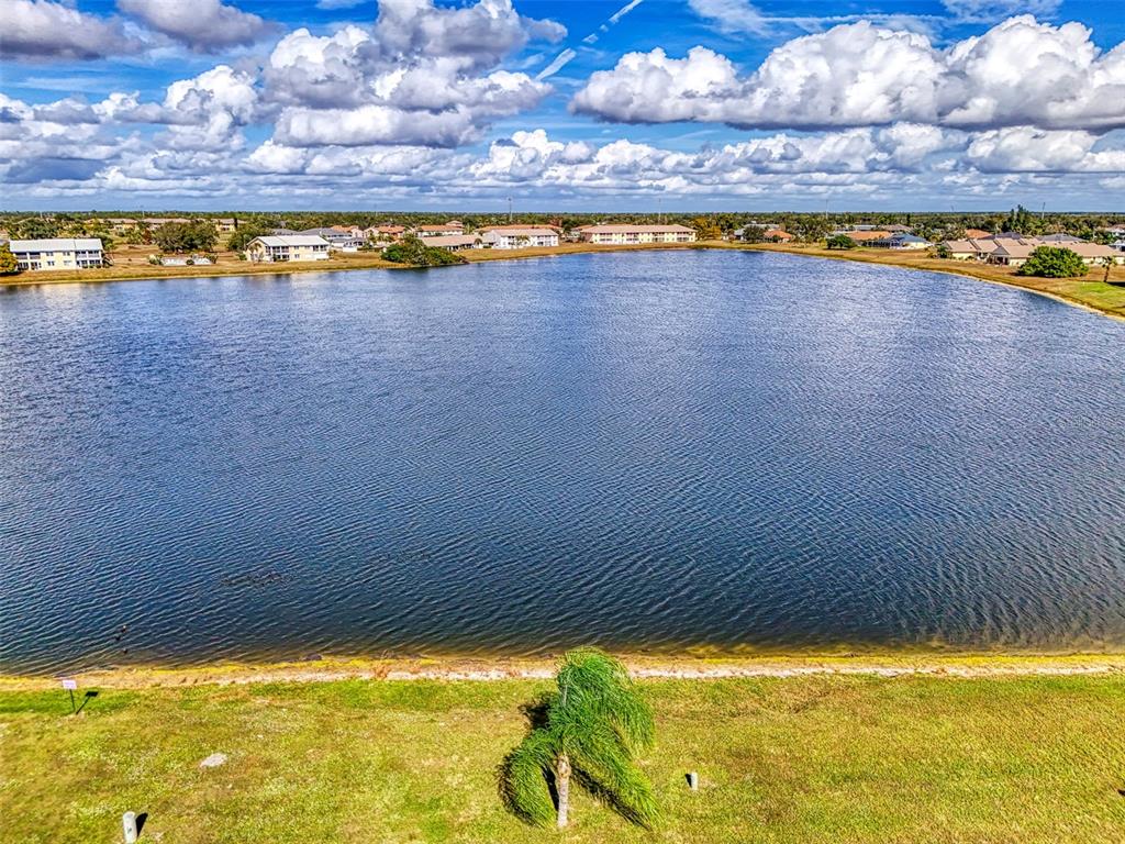 26310 Rampart Boulevard, Unit 505/E Punta Gorda, FL 33983 - Photo 48 of 64 a view of a swimming pool and an outdoor seating