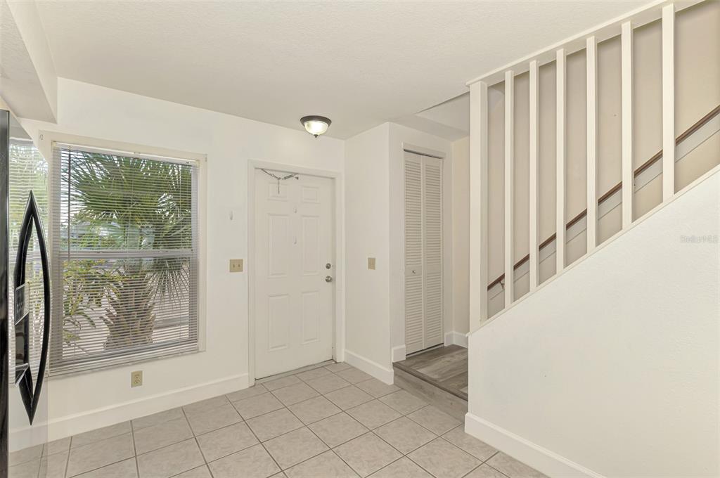 26310 Rampart Boulevard, Unit 505/E Punta Gorda, FL 33983 - Photo 5 of 64 a view of entryway with wooden floor and door