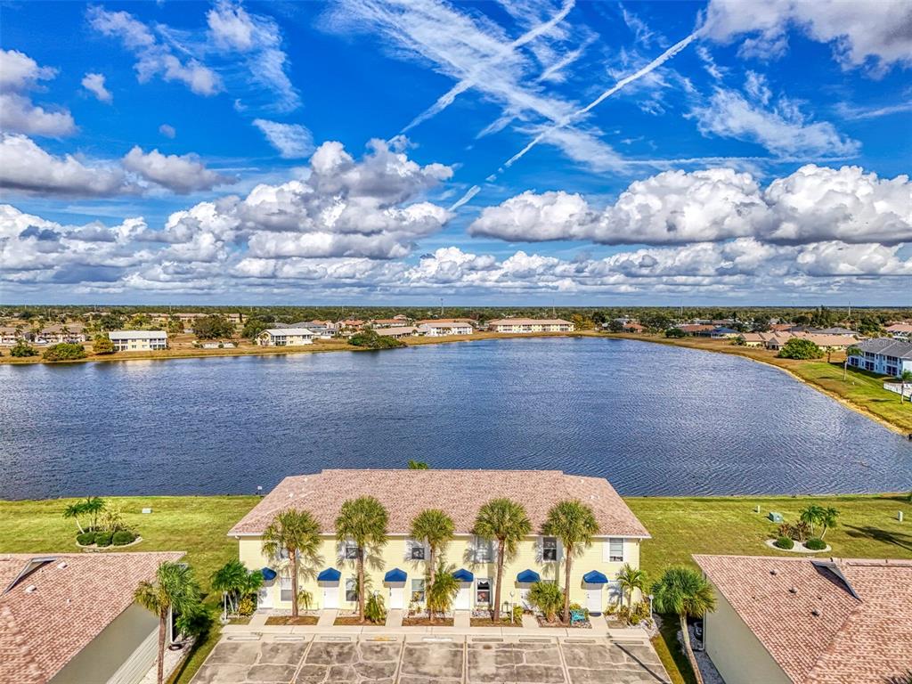 26310 Rampart Boulevard, Unit 505/E Punta Gorda, FL 33983 - Photo 60 of 64 a view of swimming pool with an outdoor seating