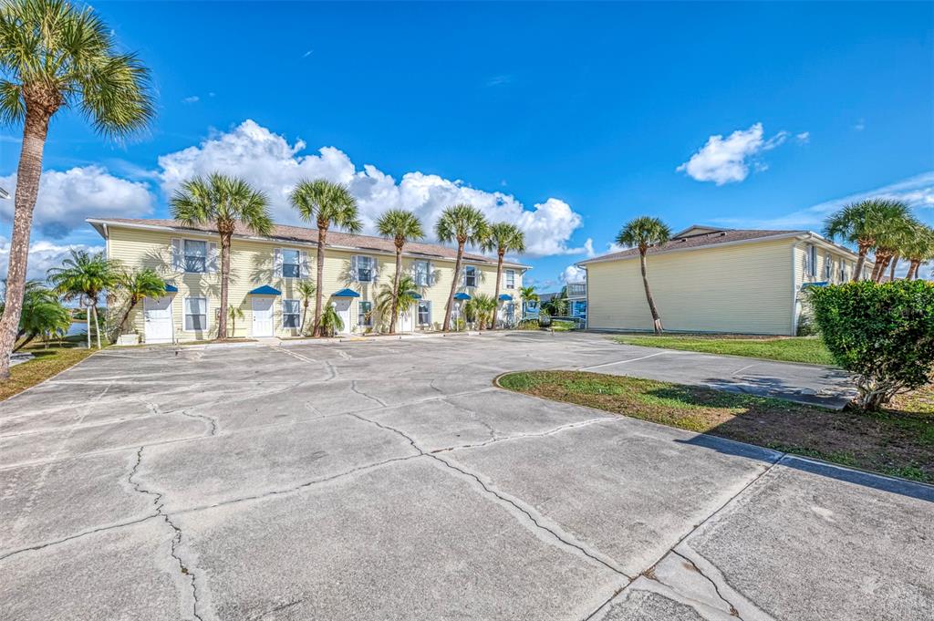 26310 Rampart Boulevard, Unit 505/E Punta Gorda, FL 33983 - Photo 63 of 64 a view of a house with a yard