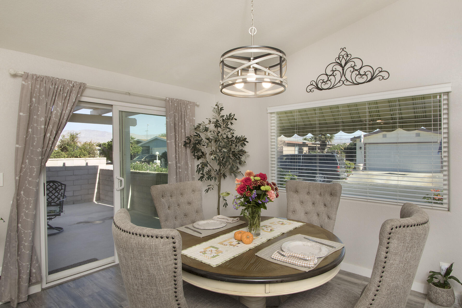 74986 Conestoga Thousand Palms, CA 92276 - Photo 11 of 29 a view of a dining room with furniture window and wooden floor