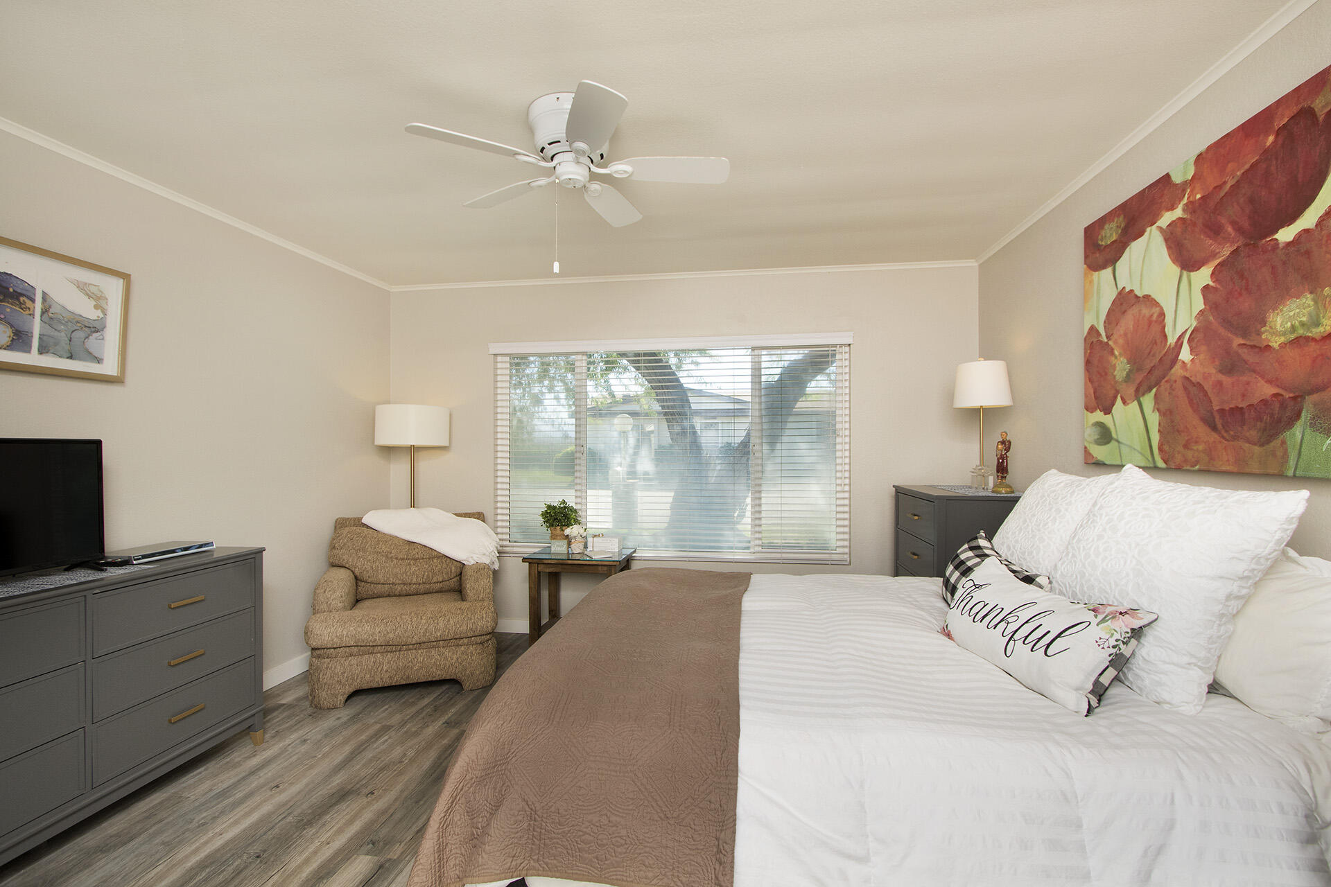 74986 Conestoga Thousand Palms, CA 92276 - Photo 16 of 29 a bedroom with a large bed and a window