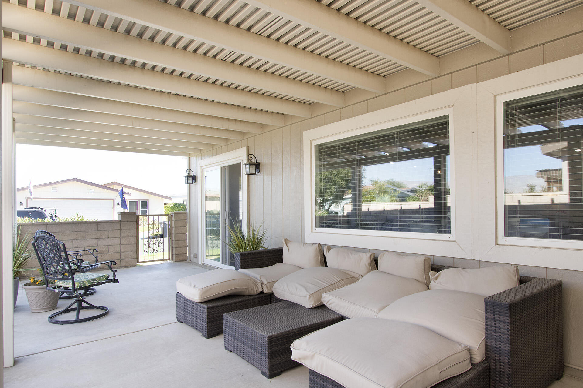 74986 Conestoga Thousand Palms, CA 92276 - Photo 17 of 29 a living room with furniture and floor to ceiling windows