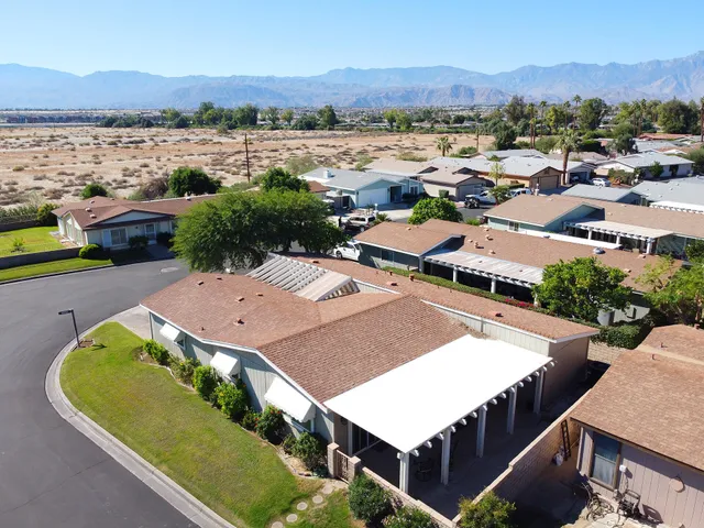 an aerial view of a house with a garden