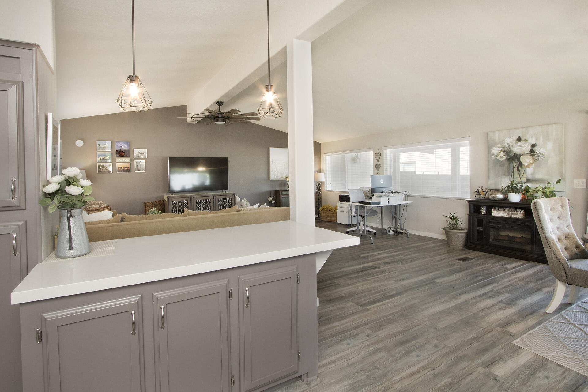 74986 Conestoga Thousand Palms, CA 92276 - Photo 9 of 29 a kitchen with a sink dishwasher a dining table and chairs with wooden floor