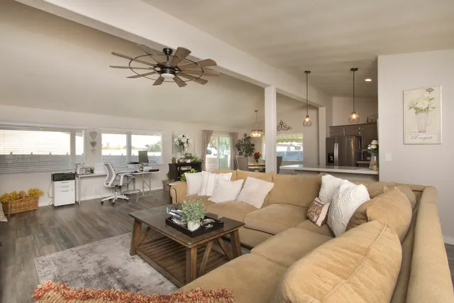 a living room with furniture and a large window