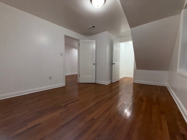 1620 West 44th Street Chicago, IL 60609 - Photo 6 of 37 an empty room with wooden floor and windows