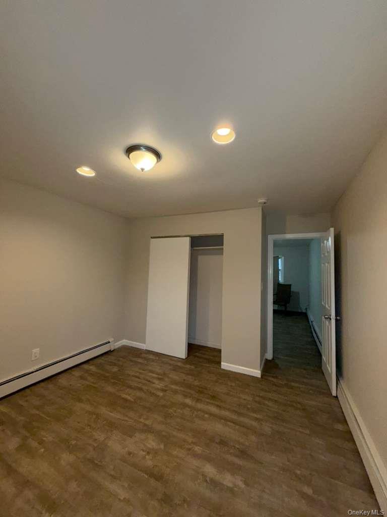 27 Panamoka Trail Ridge, NY 11961 - Photo 9 of 9 an empty room with an entryway