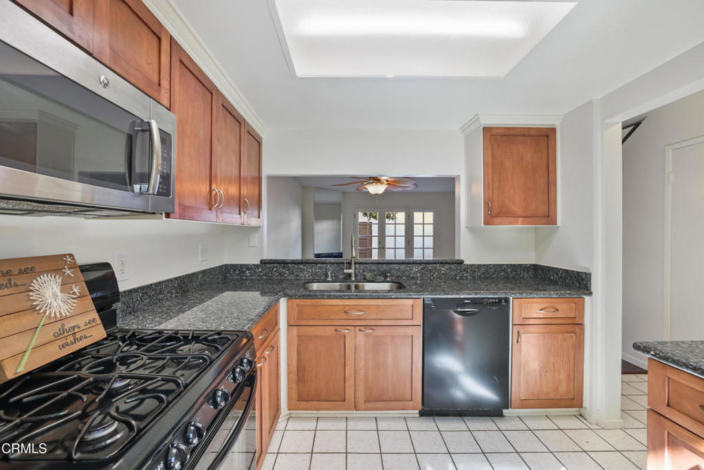 3183 Kelp Lane Oxnard, CA 93035 - Photo 3 of 23 a kitchen with granite countertop a stove and a sink