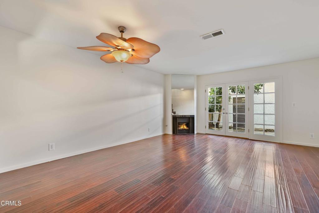 3183 Kelp Lane Oxnard, CA 93035 - Photo 6 of 23 wooden floor in an empty room with a window