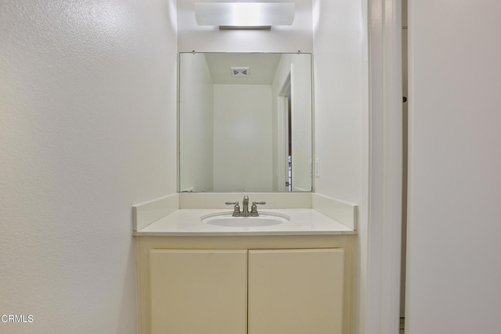 3183 Kelp Lane Oxnard, CA 93035 - Photo 9 of 23 a bathroom with a sink and a mirror