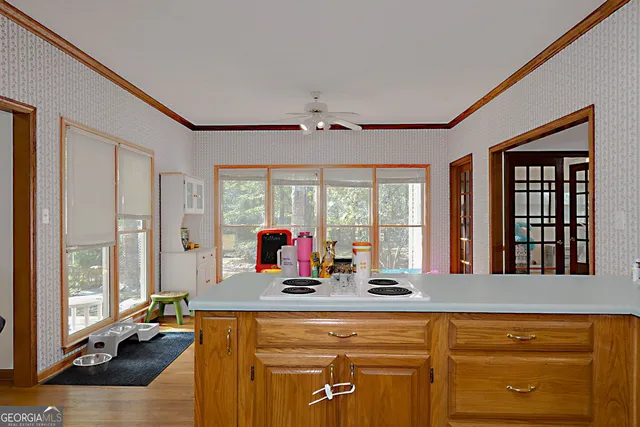 a living room with furniture and floor to ceiling window
