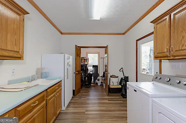 a bathroom with a sink a mirror and shower