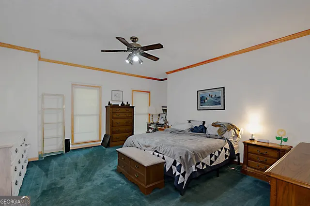 a bedroom with a bed and furniture