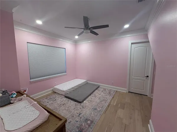 a bedroom with furniture and a window