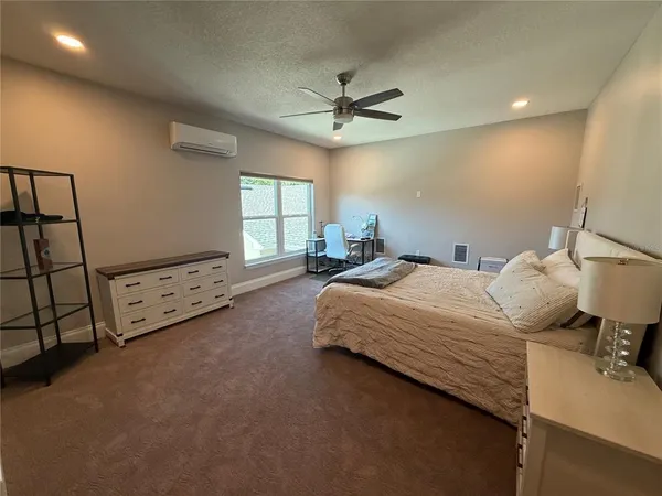 a room with a table chair and wooden floor