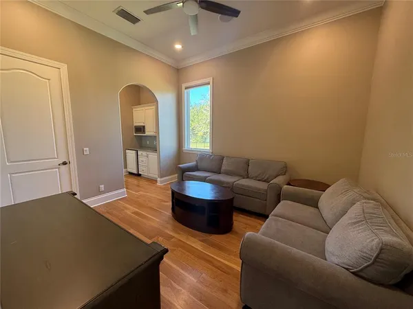 a view of a room with wooden floor