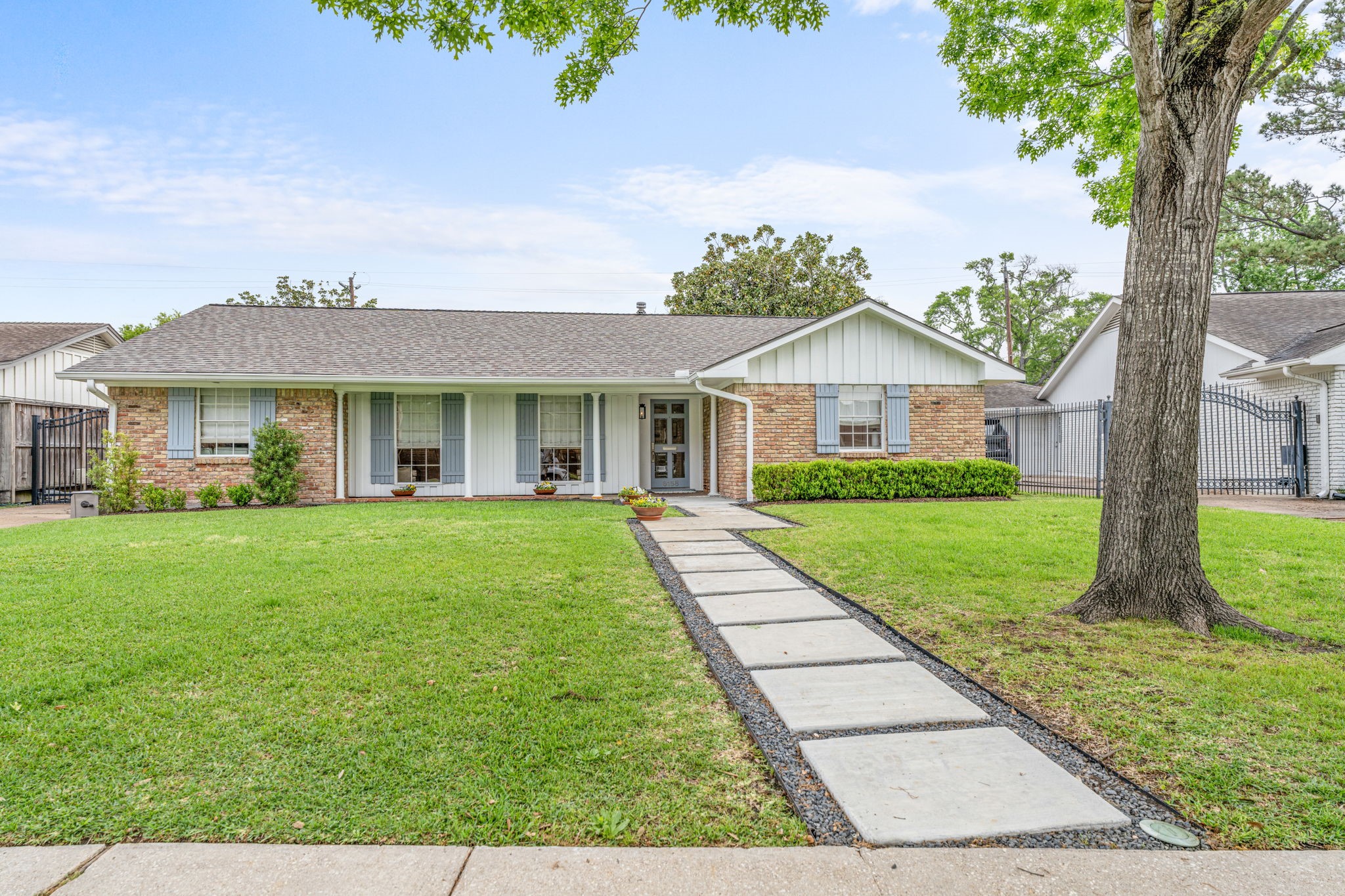 6158 Burgoyne Road Houston, TX 77057 - Photo 2 of 37 a front view of a house with a yard