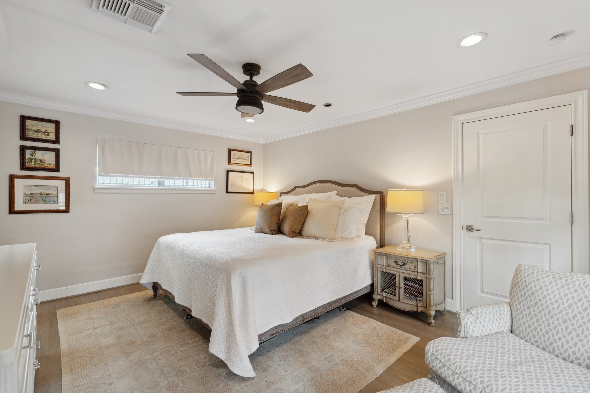 6158 Burgoyne Road Houston, TX 77057 - Photo 26 of 37 a bedroom with a bed a couch and a window