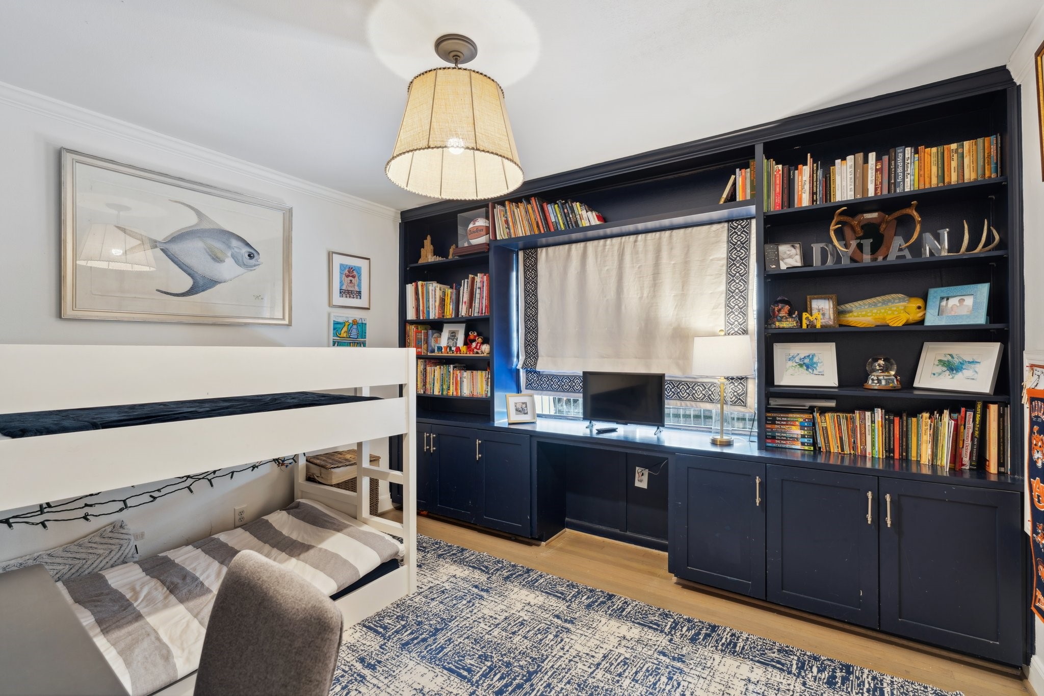 6158 Burgoyne Road Houston, TX 77057 - Photo 30 of 37 a view of a workspace with furniture and a book shelf
