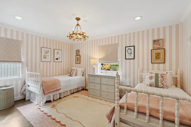 a bedroom with a bed and a curtain