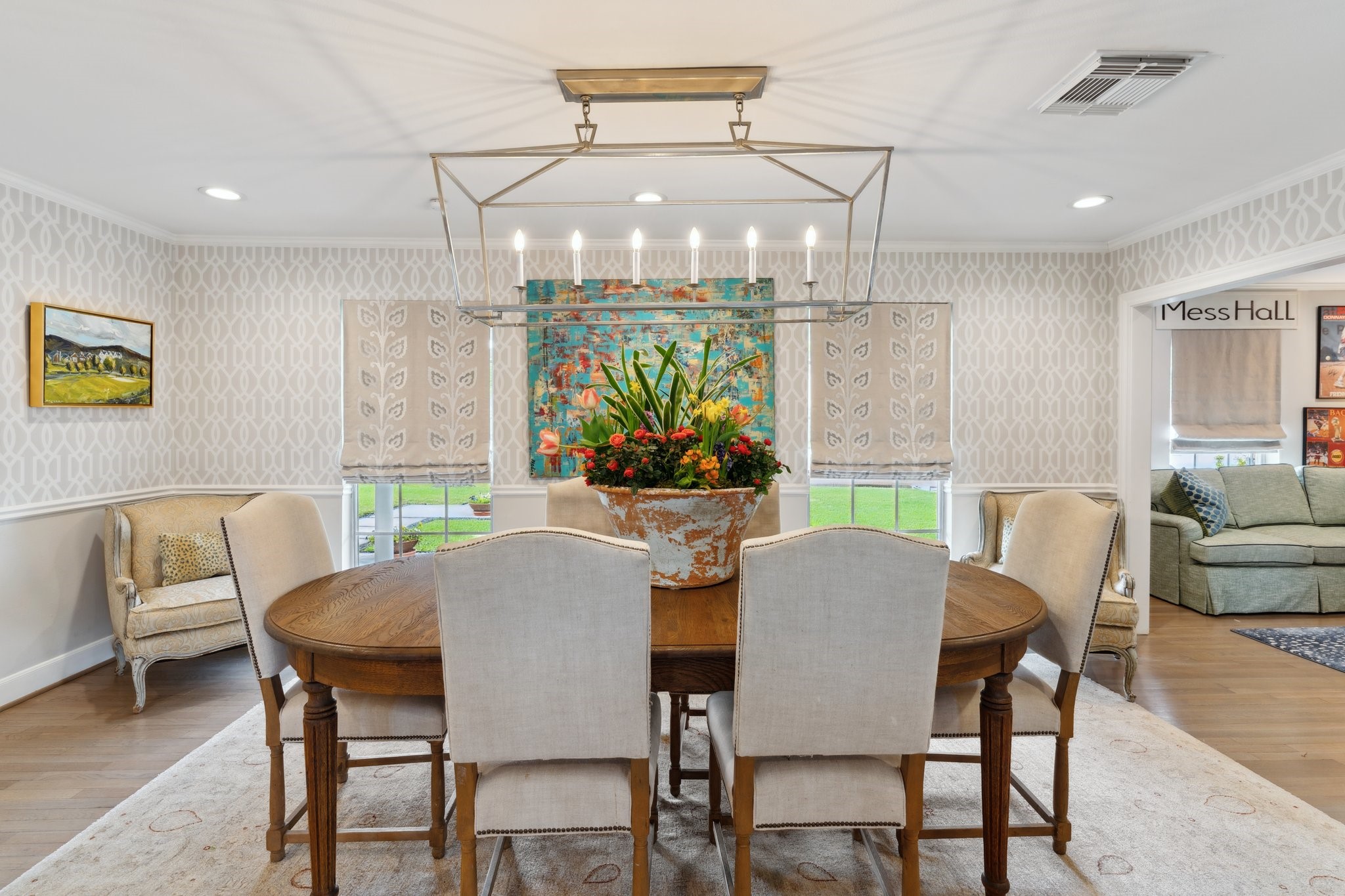 6158 Burgoyne Road Houston, TX 77057 - Photo 8 of 37 a view of a dining room with furniture a chandelier and wooden floor