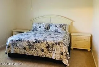 a bathroom with a toilet and a shower curtain
