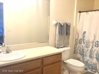 a bedroom with a bed and a table