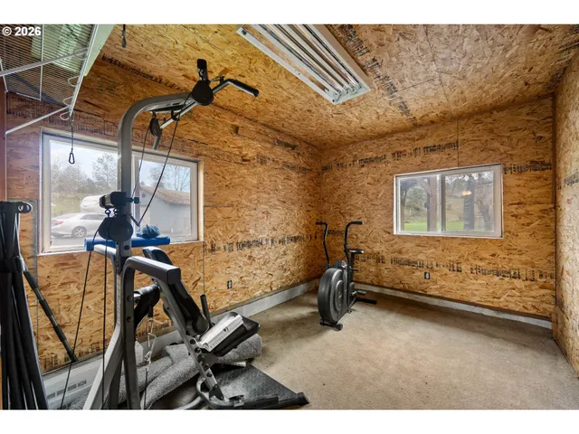a view of an chairs and table in a room