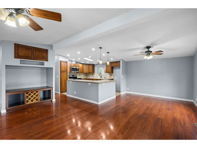 a view interior of a house wooden floor and a kitchen view