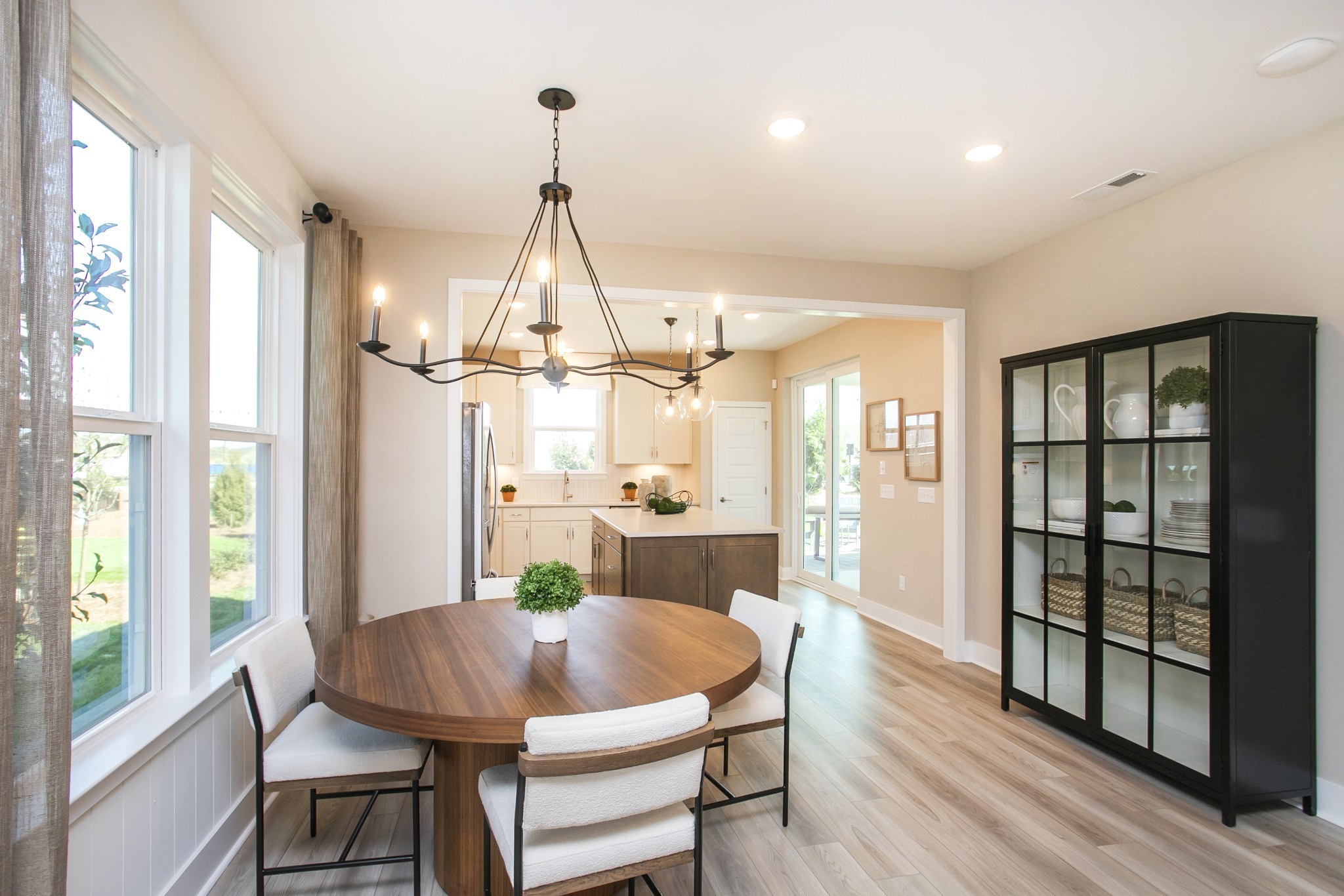 509 Scarlet Oak Road Lebanon, TN 37090 - Photo 21 of 32 a dining room with furniture a chandelier and wooden floor