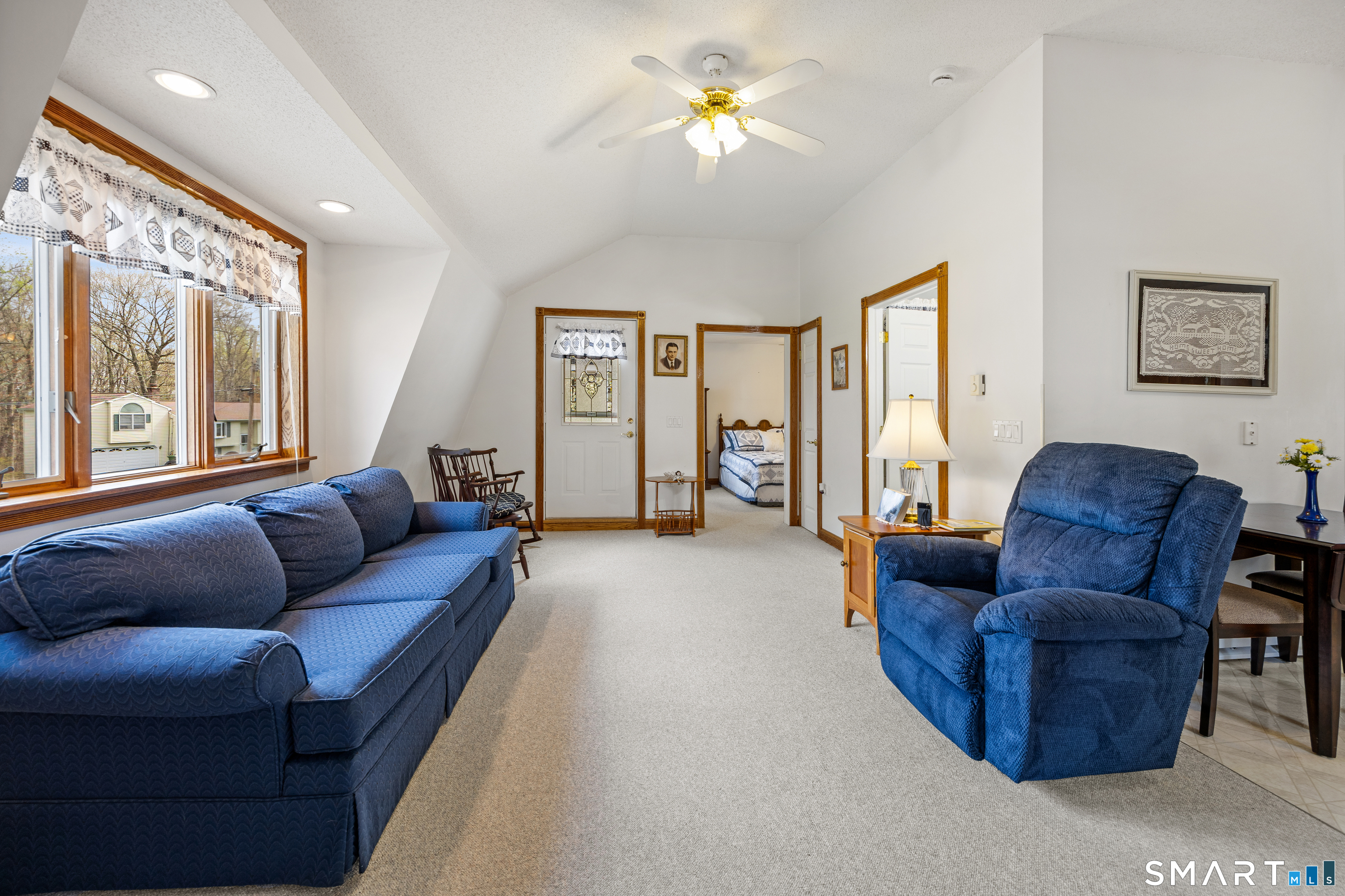 42 Chimney Sweep Road Wallingford, CT 06492 - Photo 32 of 40 a living room with furniture a ceiling fan and a window
